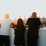 four person looking at the city. Christian business leader fostering integrity and values-driven relationships in a supportive workplace environment